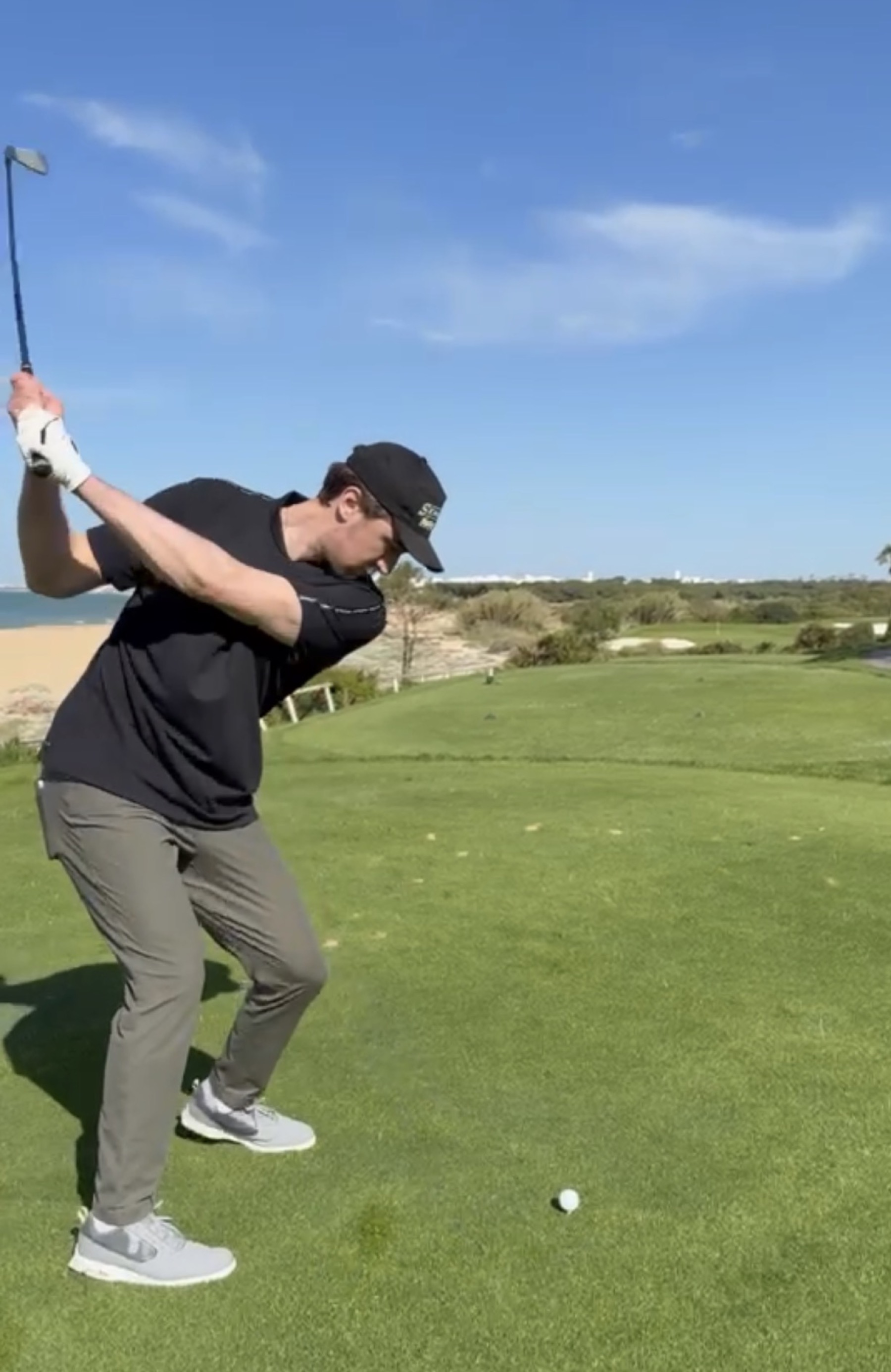 Benjamin Freeman golfing.